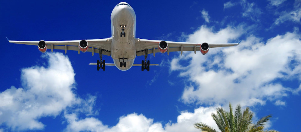 a picture of an airplane flying to aruba