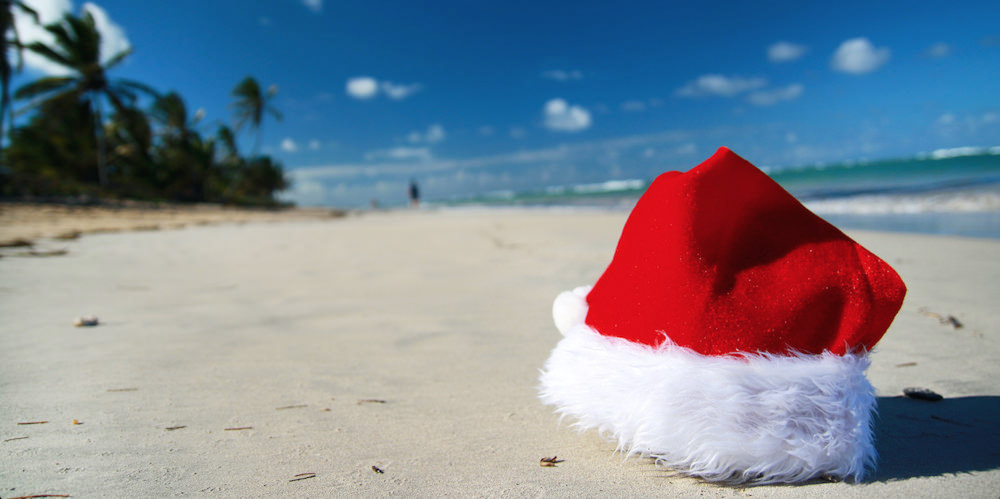 a picture of Santa Claus hat on Aruba beach during Christmas in Aruba