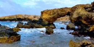 a picture of black stone beach in aruba