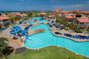 The outdoor pool and waterslide at the All Inclusive Divi Village Golf and Beach Resort Aruba