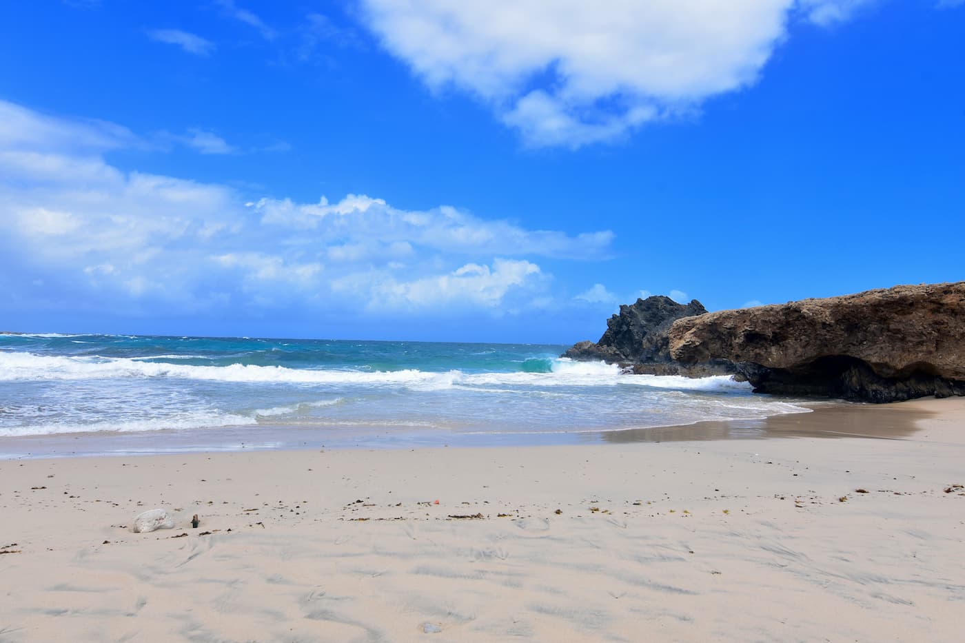 Andicuri Beach, Aruba. It's a natural beauty, but can be wild! Soft sand, a few rocks and beautiful water. Not to be missed!