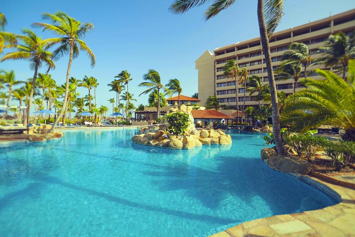 the outdoor pool and terrace at the Barceló Aruba