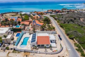 drone view of a beachfront villa near arashi beach in aruba