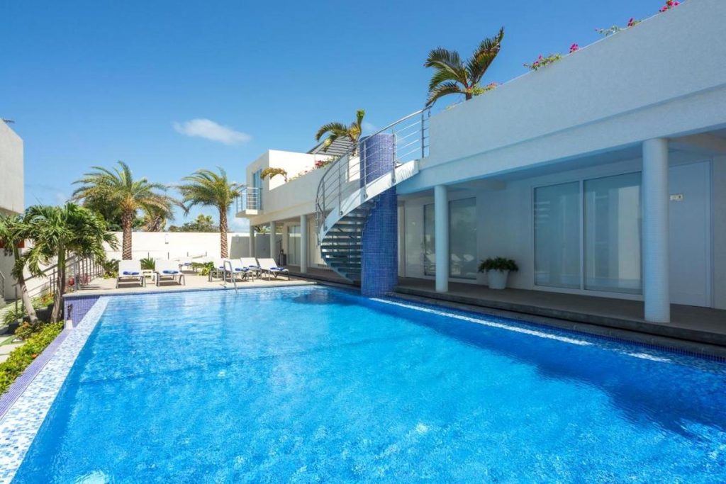 A view of the outdoor pool and sun terrace at the Ocean Z Boutique Hotel in Aruba, Dutch Caribbean.